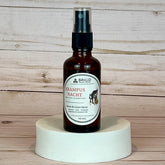 krampusnacht room and linen spray Brown spray bottle labeled 'Brigid Krampus Nacht' on a wooden background